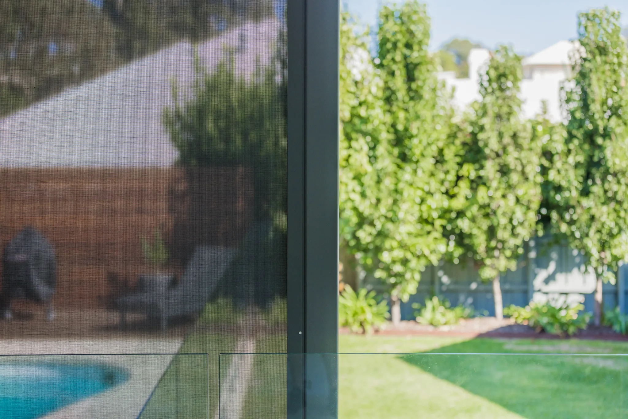 Slidetrack outdoor blinds enclosing a poolside alfresco in Floreat