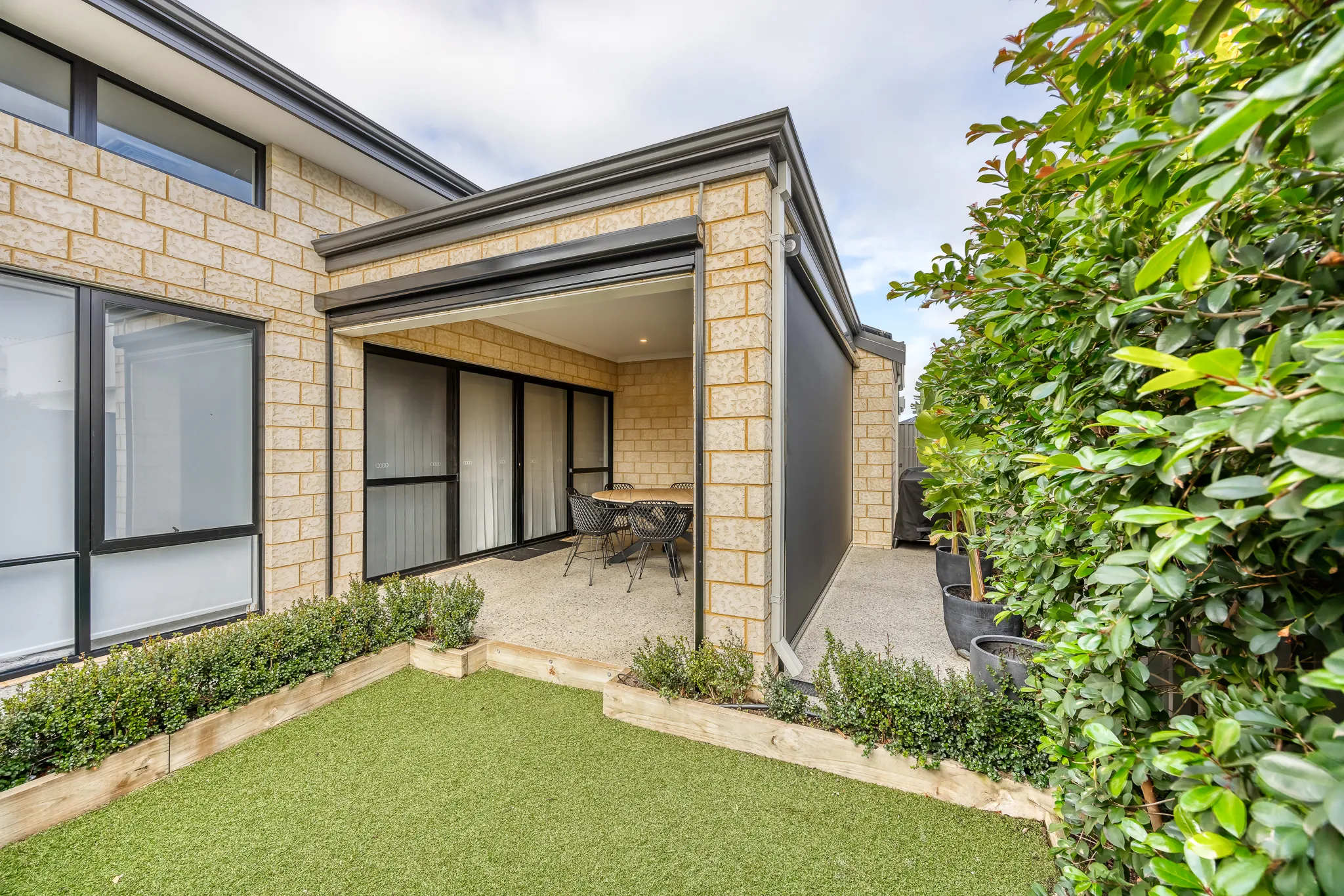 Ziptrak blinds enclosing a brick alfresco in Treeby