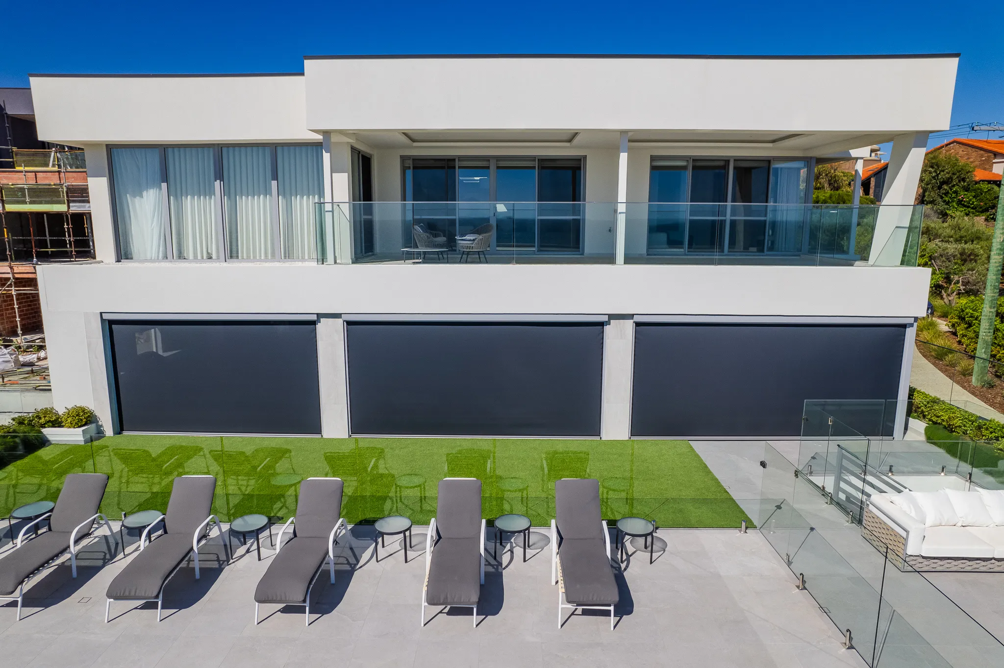 Ziptrak blinds along the pool terrace of a City Beach home