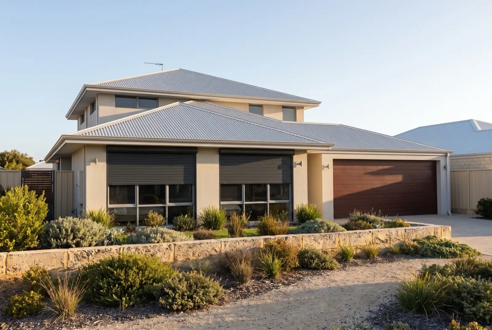 Illustration of charcoal roller shutters on a modern two storey house near the coast