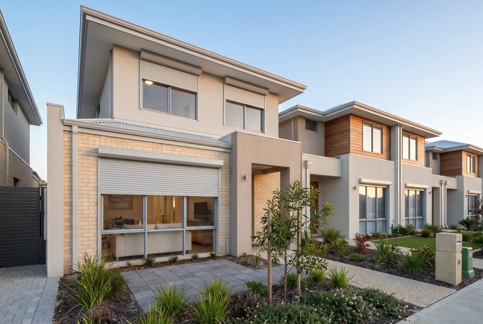 Illustration of pale grey roller shutters on two storey townhouses