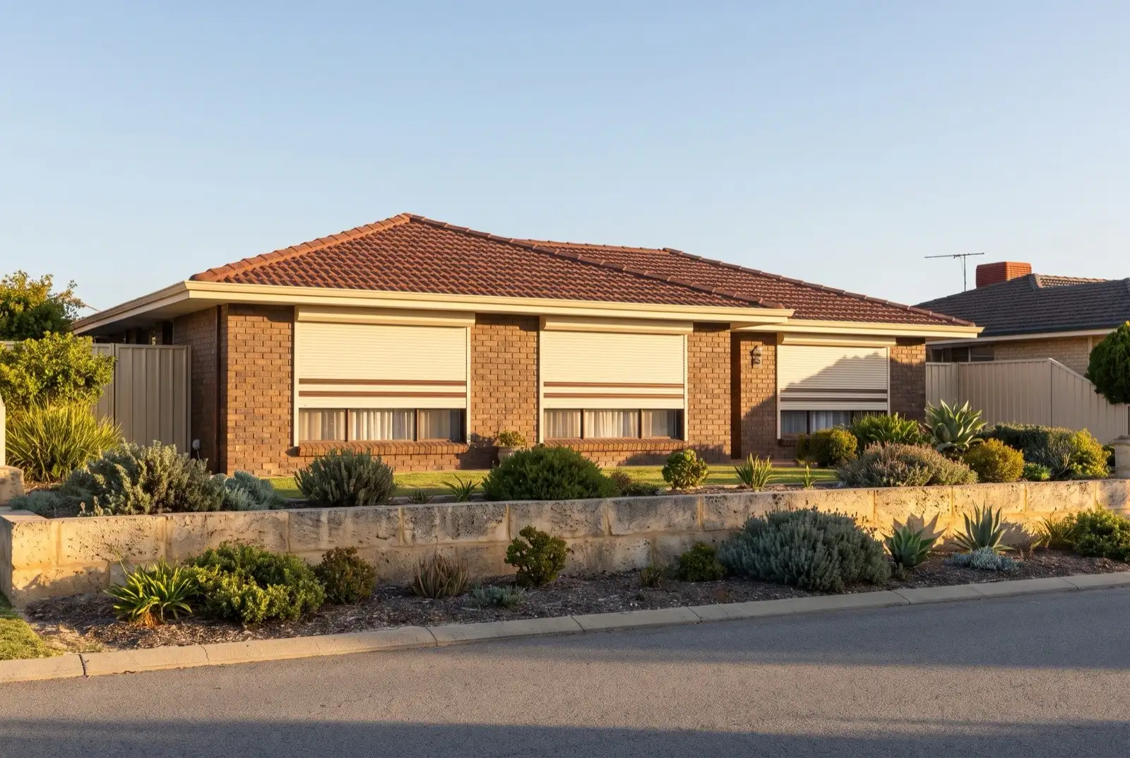 Illustration of off-white roller shutters on a 1970s brick house near the coast