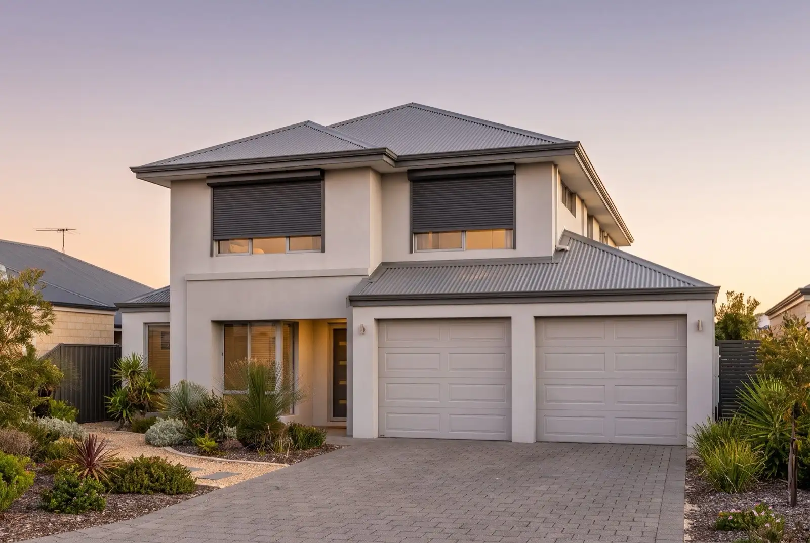 Illustration of charcoal roller shutters on a modern two storey house