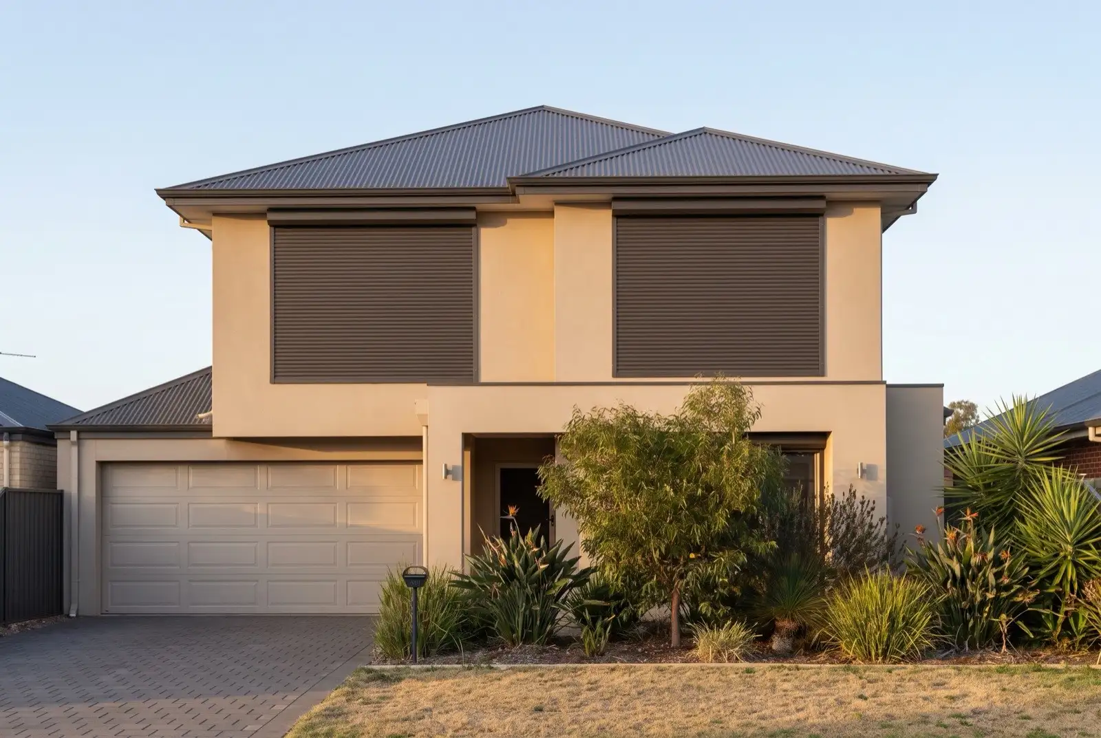 Illustration of dark bronze roller shutters on a modern two storey house