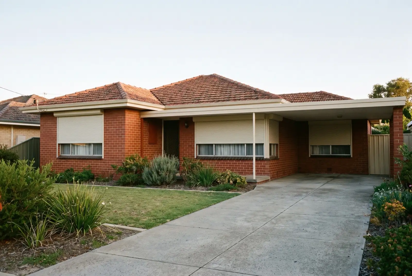 Illustration of off-white roller shutters on a 1950s brick and tile house