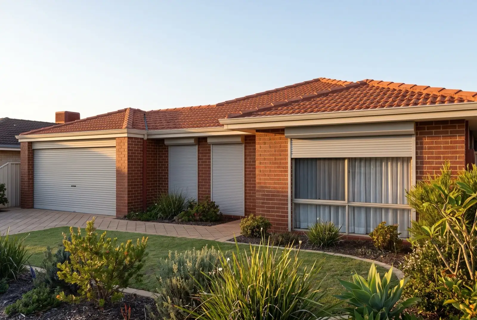 Illustration of pale grey roller shutters on a 1990s brick house