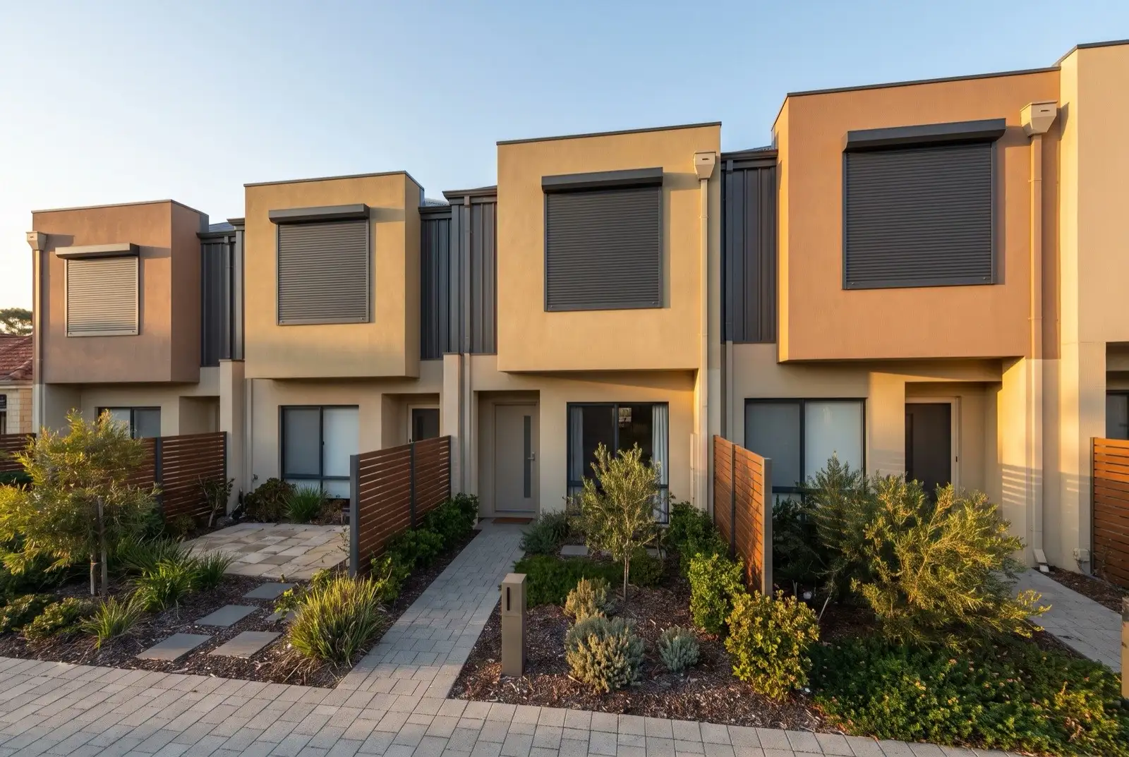 Illustration of charcoal roller shutters on two storey townhouses