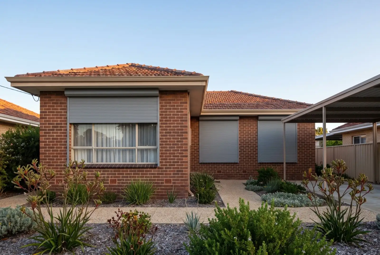 Illustration of mid grey roller shutters on a 1950s brick and tile house
