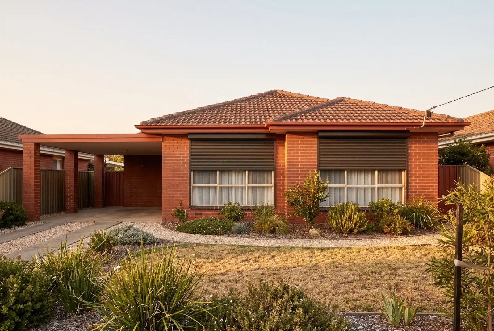 Illustration of dark bronze roller shutters on a 1950s brick and tile house