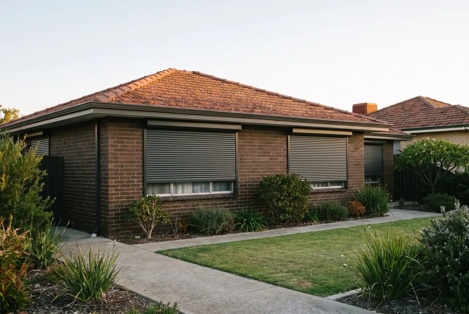 Illustration of charcoal roller shutters on a 1970s brick house