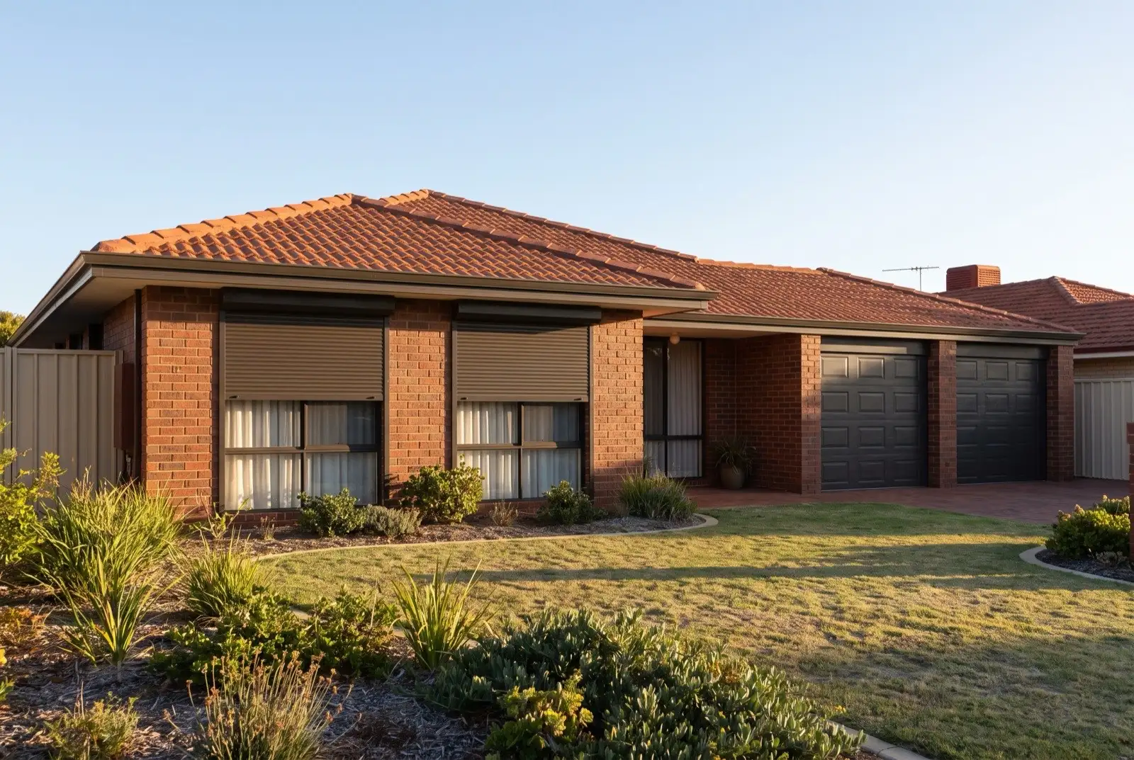 Illustration of dark bronze roller shutters on a 1990s brick house