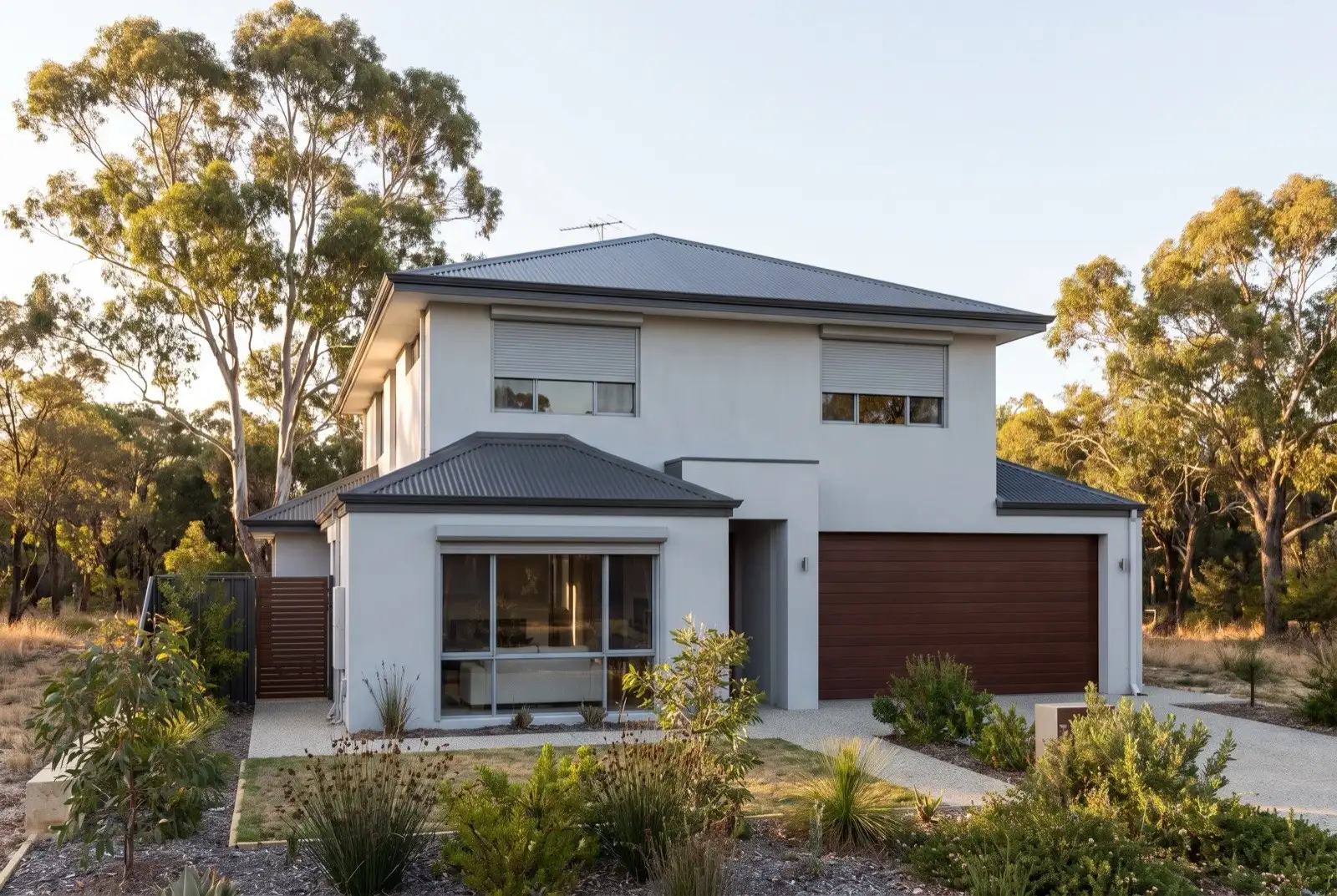 Illustration of mid grey roller shutters on a modern two storey house on a bush block