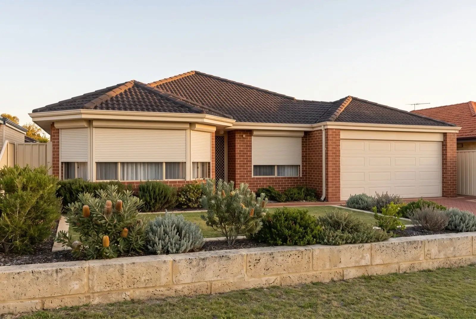 Illustration of off-white roller shutters on a 1990s brick house near the coast