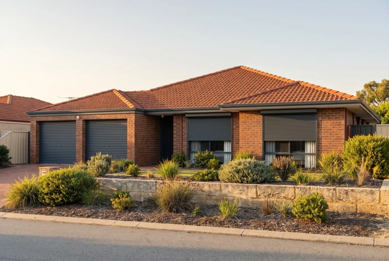 Illustration of charcoal roller shutters on a 1990s brick house near the coast