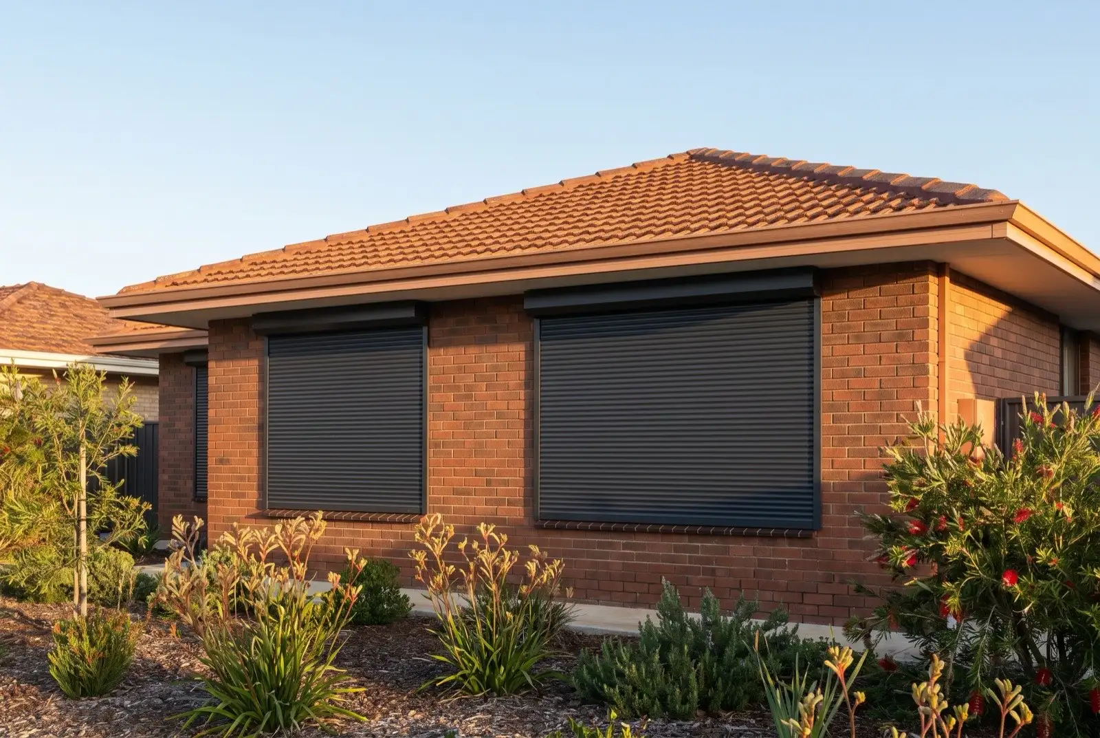Illustration of charcoal roller shutters on a 1970s brick house