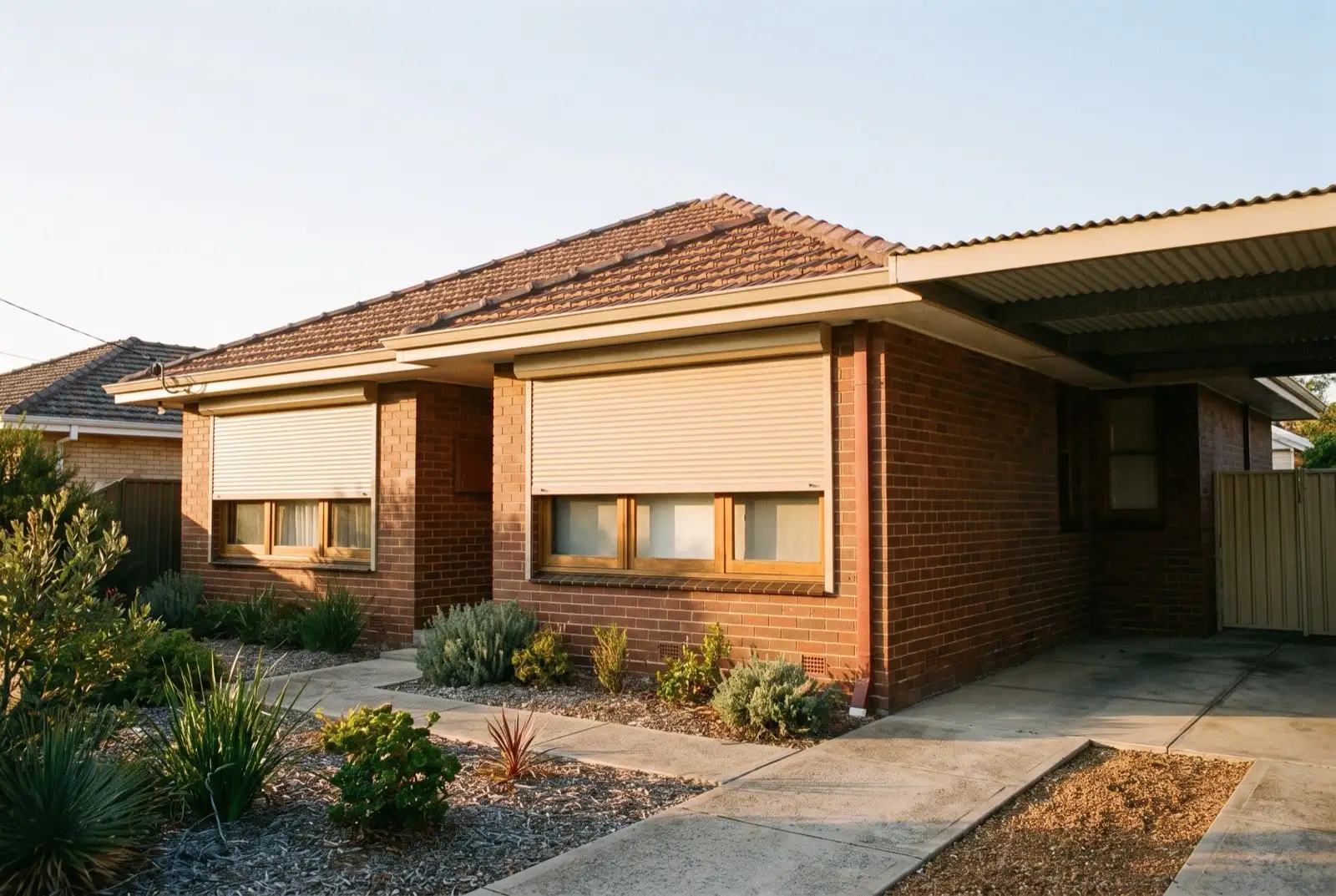 Illustration of warm beige roller shutters on a 1950s brick and tile house