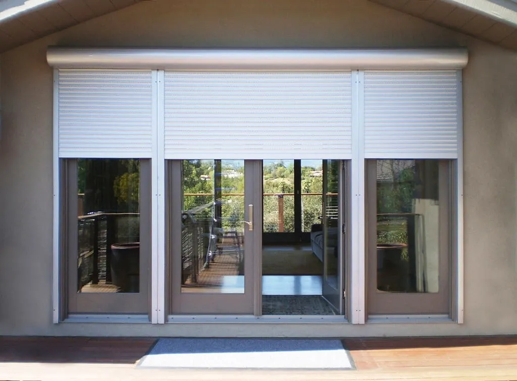Cream roller shutters over the sliding doors of a Perth home