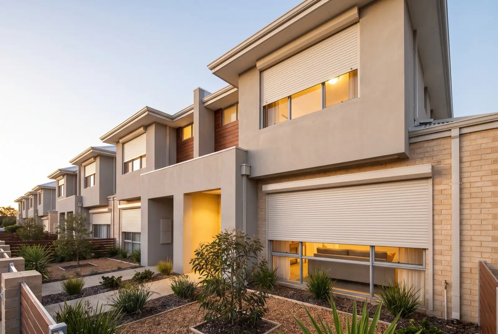 Illustration of off-white roller shutters on two storey townhouses