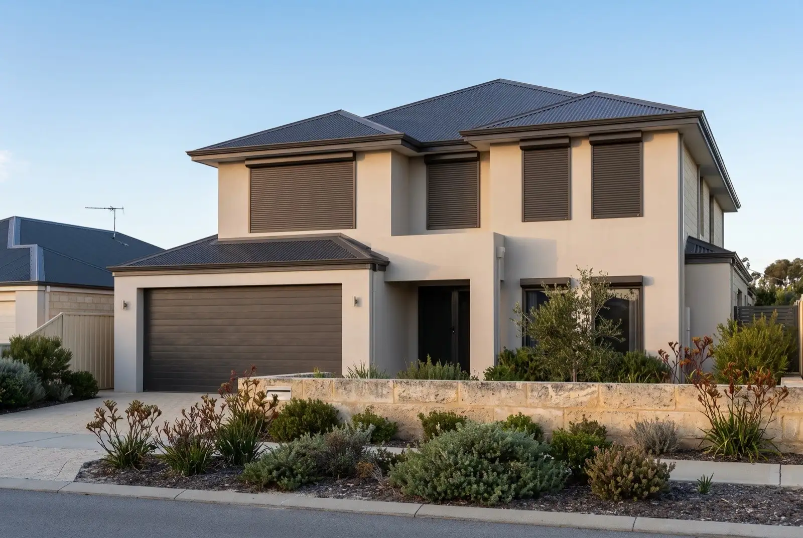 Illustration of dark bronze roller shutters on a modern two storey house near the coast