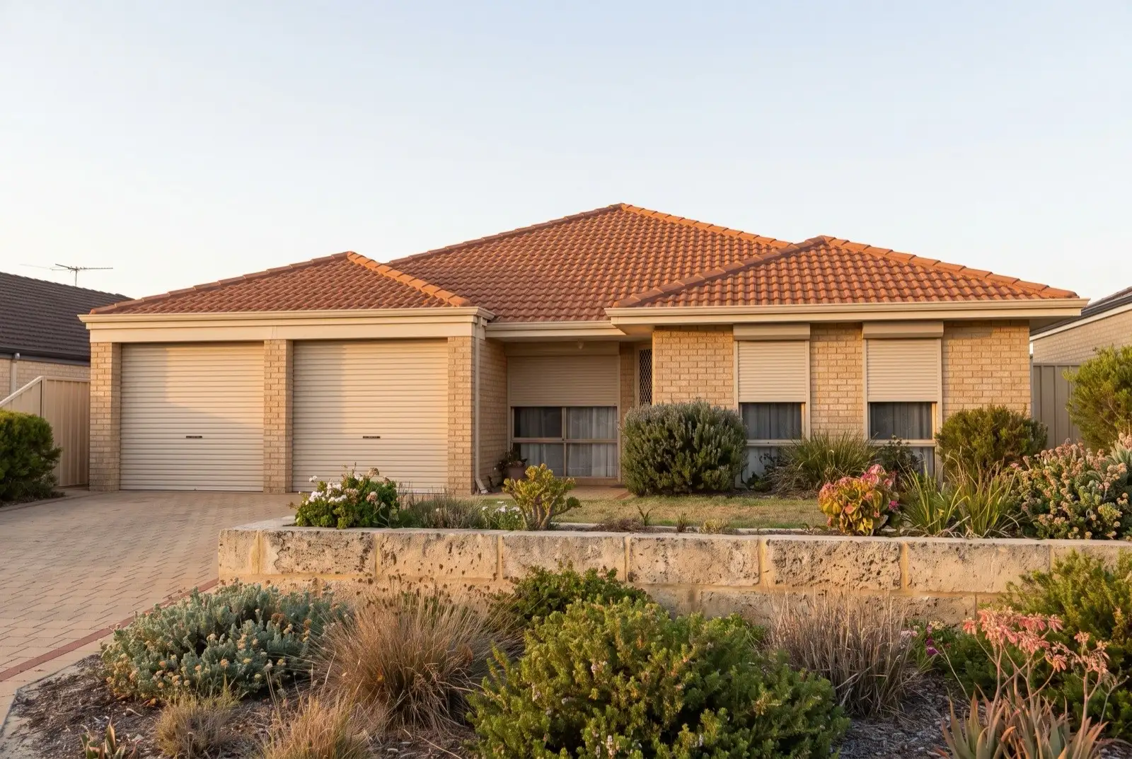 Illustration of warm beige roller shutters on a 1990s brick house near the coast