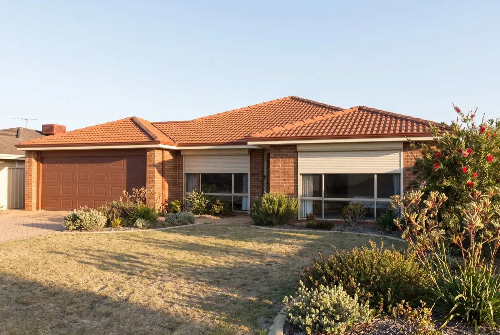 Illustration of off-white roller shutters on a 1990s brick house