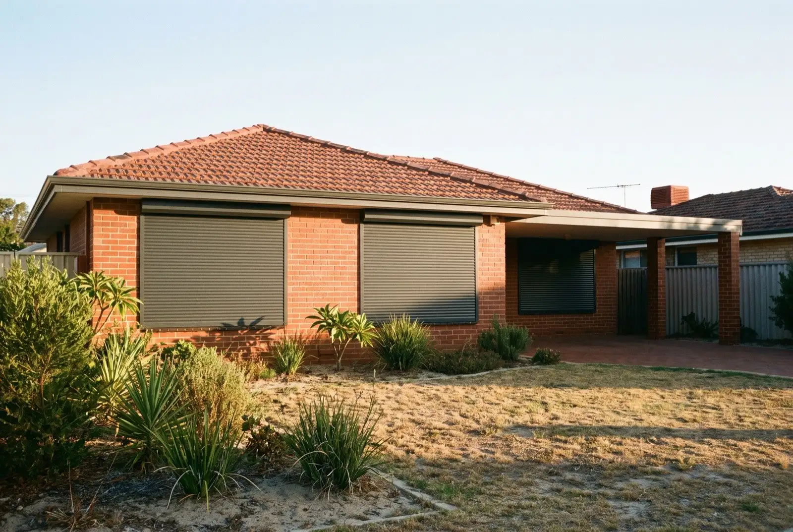 Illustration of charcoal roller shutters on a 1950s brick and tile house