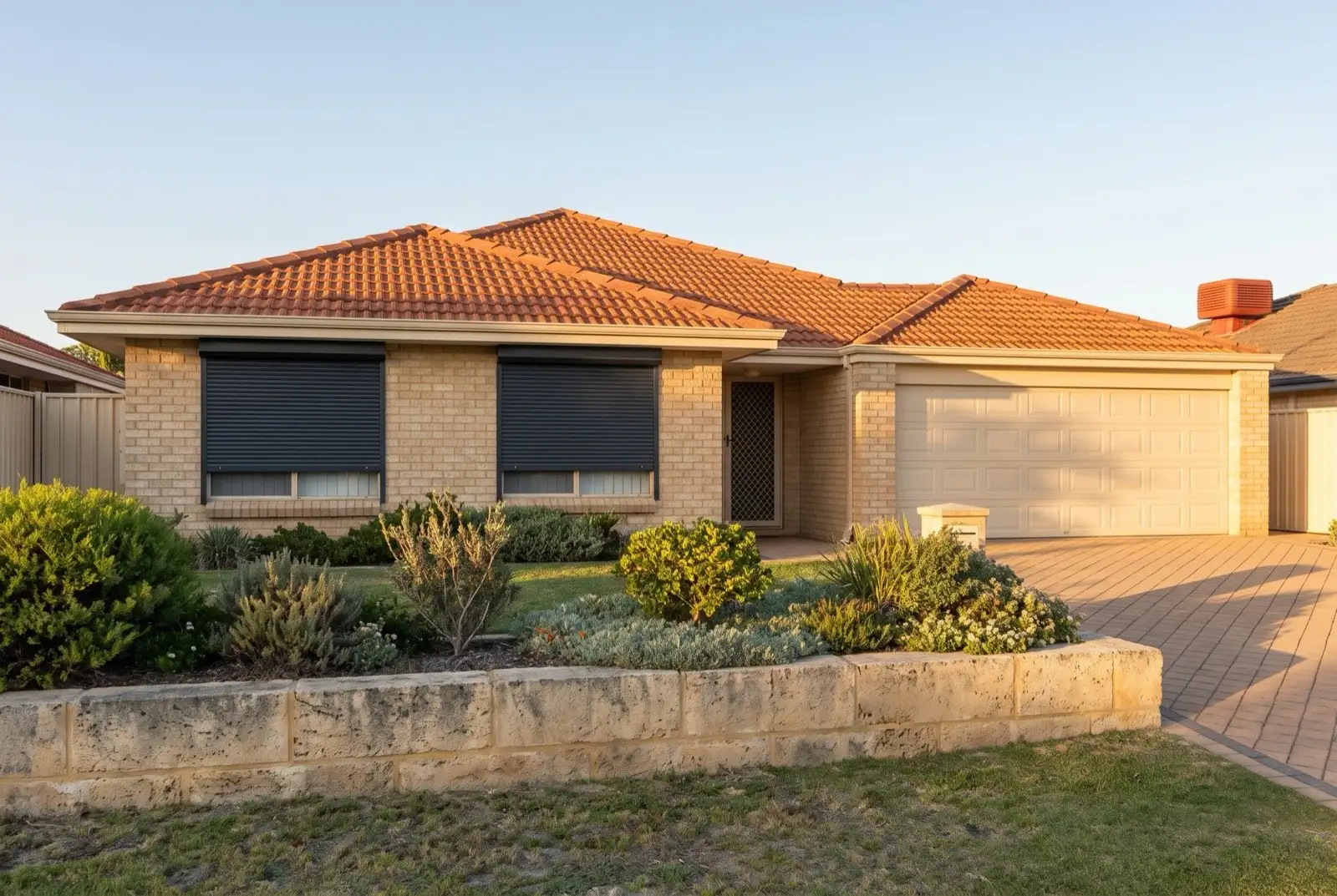 Illustration of charcoal roller shutters on a 1990s brick house near the coast
