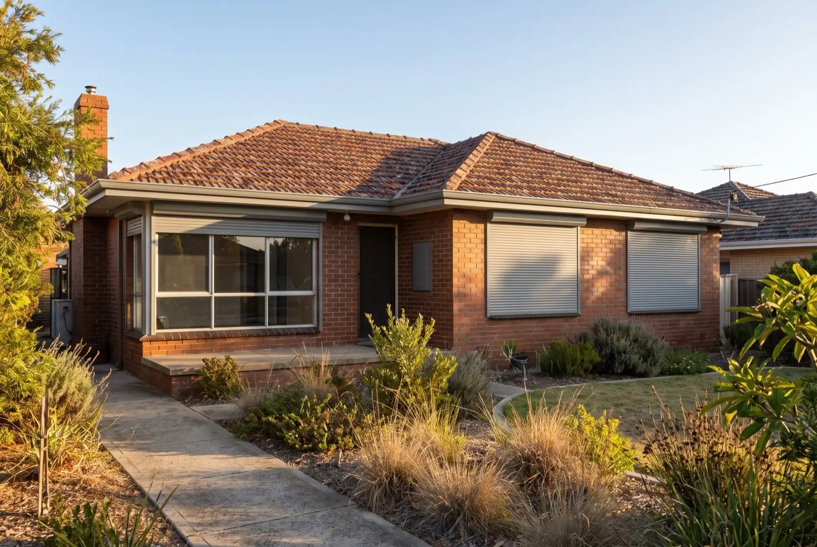 Illustration of mid grey roller shutters on a 1970s brick house
