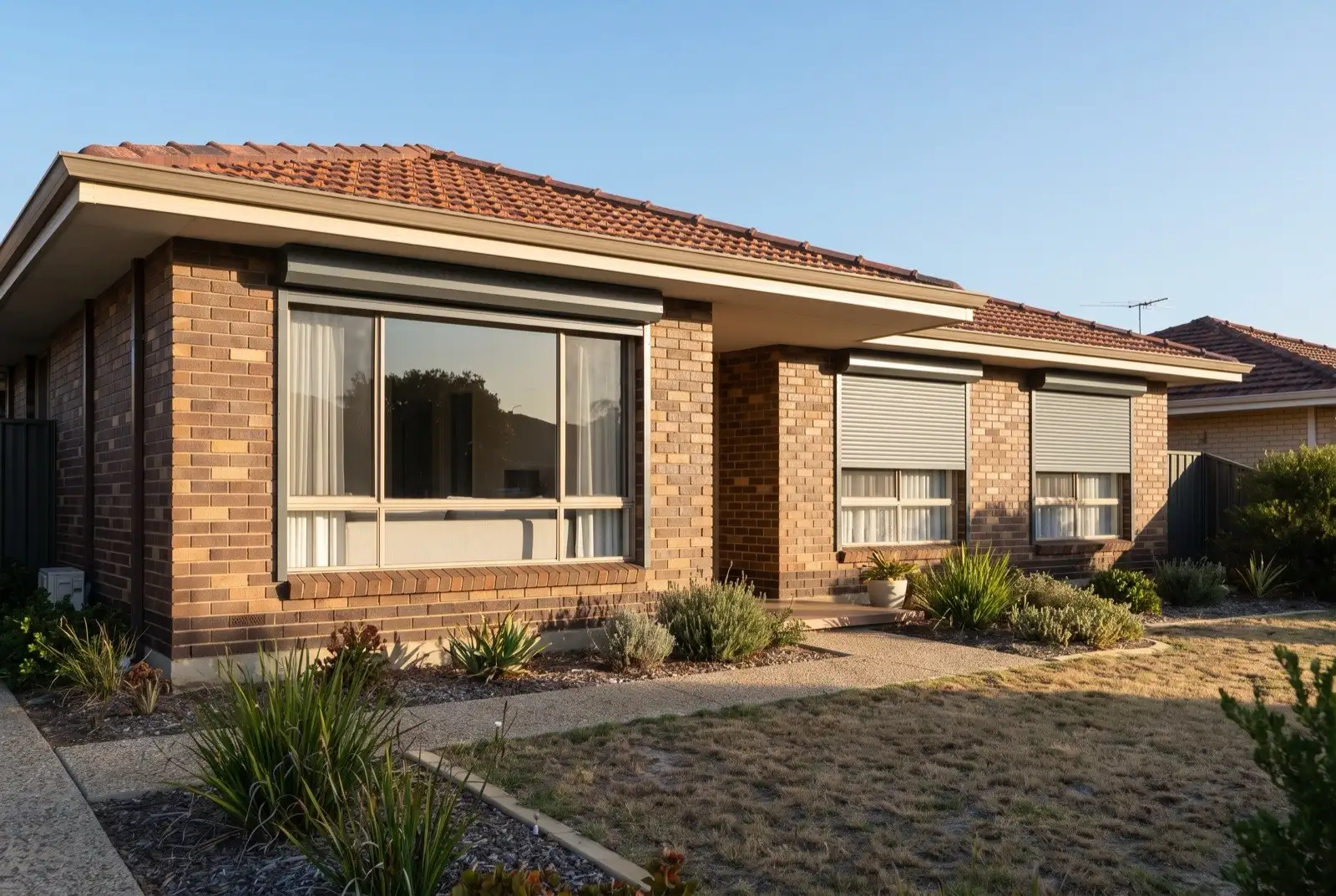 Illustration of mid grey roller shutters on a 1970s brick house