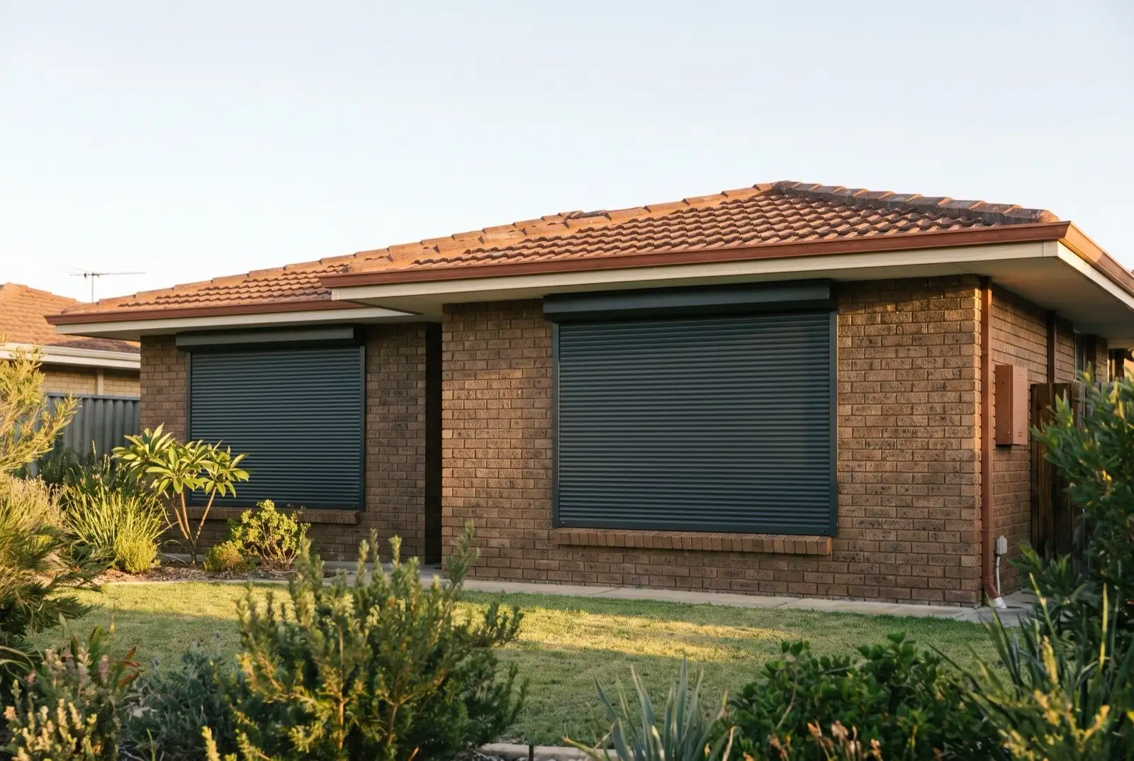 Illustration of charcoal roller shutters on a 1970s brick house